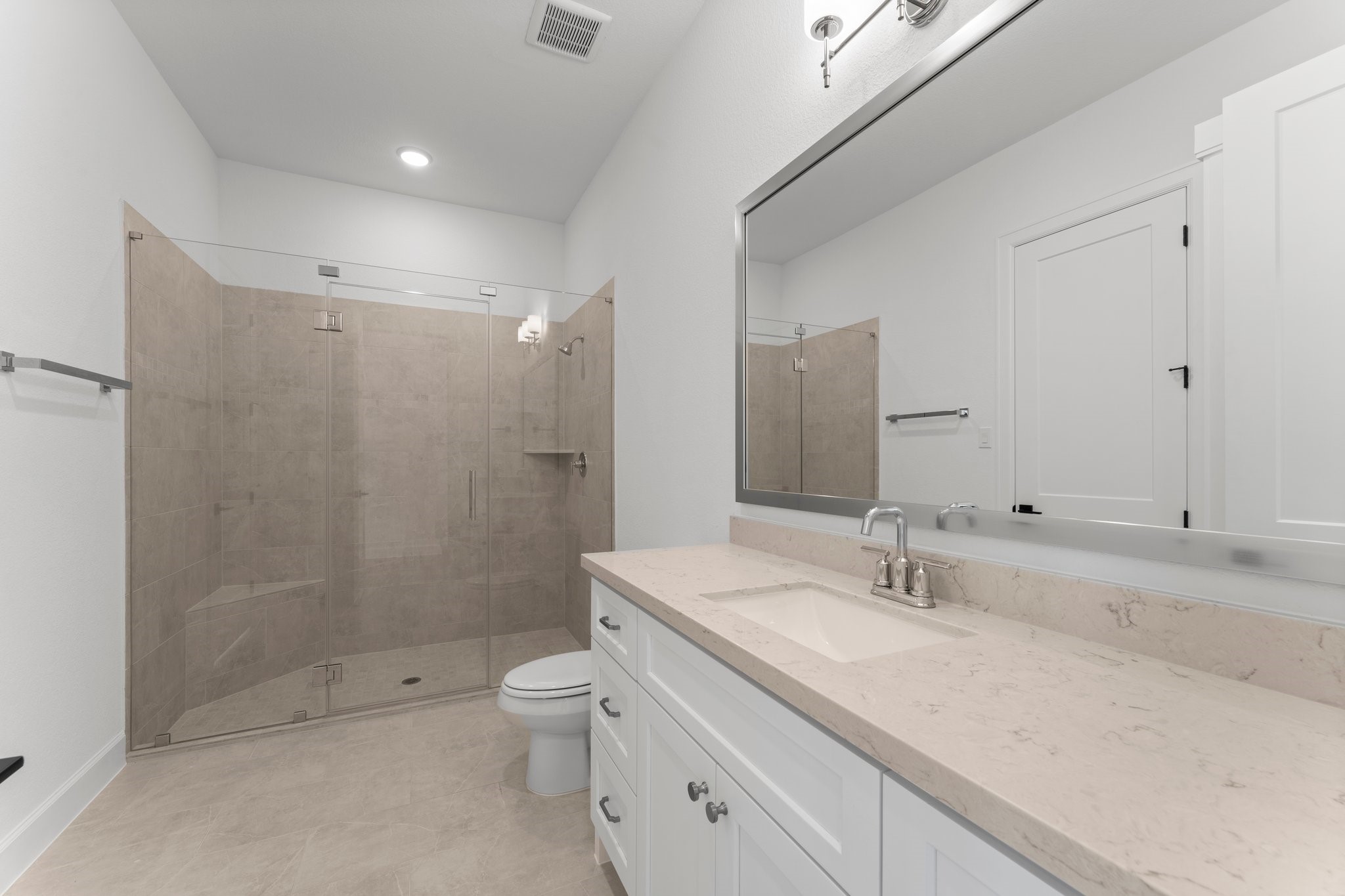 24807 Pacific Dunes Lane Spring, TX 77389 - Photo 15 of 50 a bathroom with a shower sink mirror and toilet