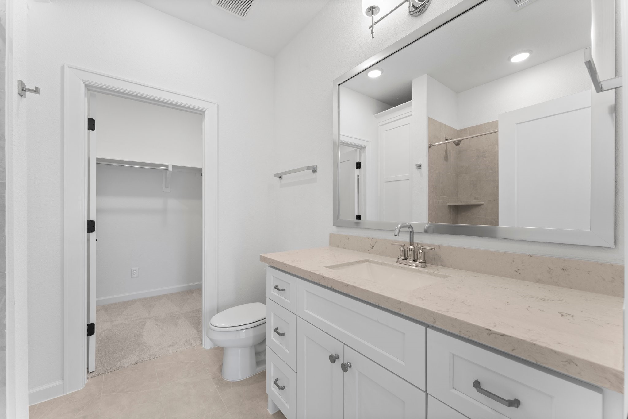 24807 Pacific Dunes Lane Spring, TX 77389 - Photo 36 of 50 a bathroom with a granite countertop toilet a sink and a mirror