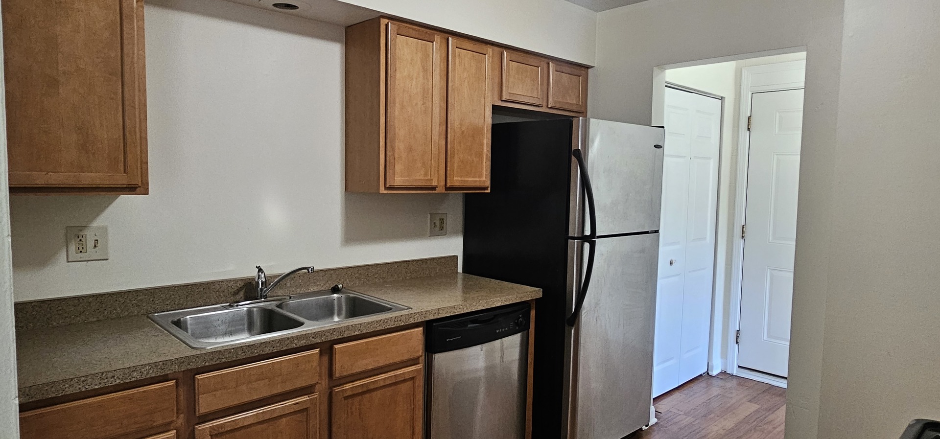 833 Village Quarter Road, Unit A3 West Dundee, IL 60118 - Photo 9 of 27 a kitchen with stainless steel appliances granite countertop a refrigerator and a sink
