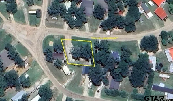 an aerial view of house with yard
