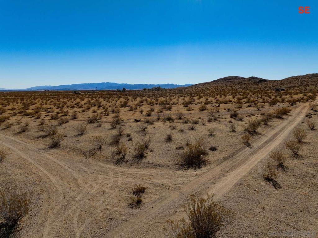 0 Sharp Terrace Drive Landers, CA 92252 - Photo 21 of 40 a view of a large mountain with a mountain in the background