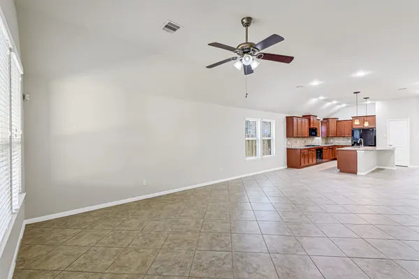 a view of a kitchen with furniture and window