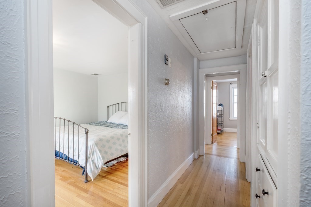 270 Russett Road Brookline, MA 02467 - Photo 21 of 39 a view of a hallway with wooden floor and staircase