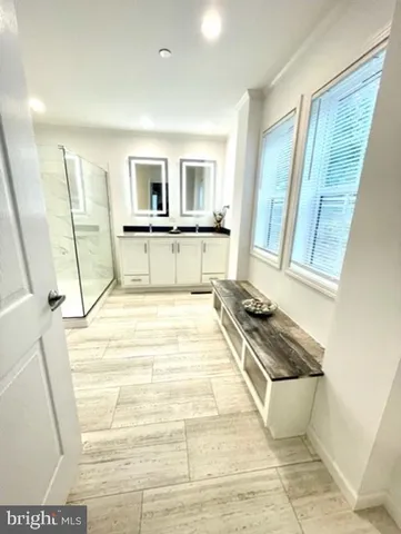 a bathroom with a bathtub and a shower