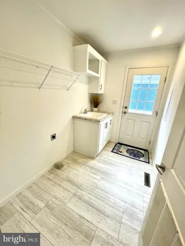 a view of a kitchen with storage and utility
