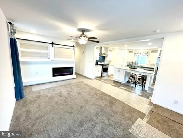 a view of a livingroom with furniture and a fireplace