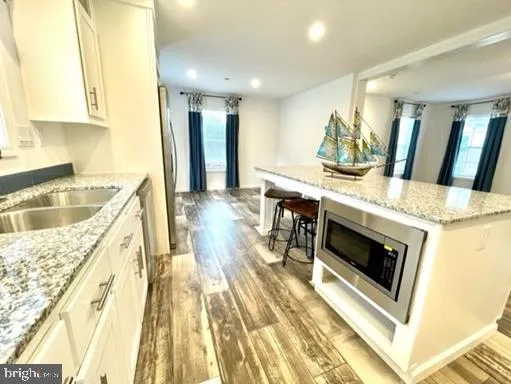 a kitchen with a stove and a sink