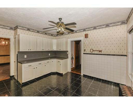 32 Birch Street Dedham, MA 02026 - Photo 11 of 25 a kitchen with granite countertop a refrigerator a sink and dishwasher