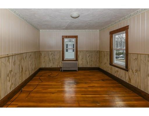 32 Birch Street Dedham, MA 02026 - Photo 16 of 25 a view of an empty room with window and wooden floor