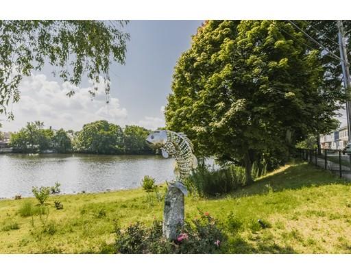 32 Birch Street Dedham, MA 02026 - Photo 25 of 25 a view of a lake with houses in the back