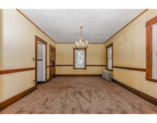 32 Birch Street Dedham, MA 02026 - Photo 8 of 25 a view of a livingroom with a chandelier