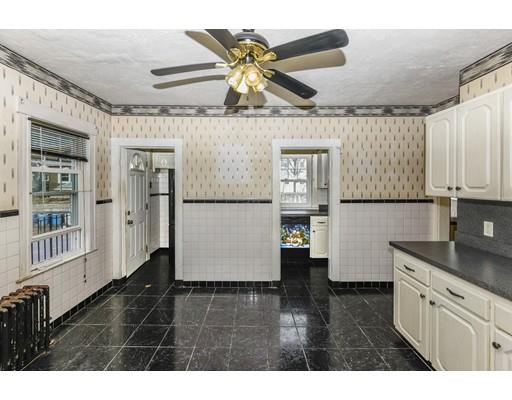 32 Birch Street Dedham, MA 02026 - Photo 10 of 25 a kitchen with a refrigerator and a sink