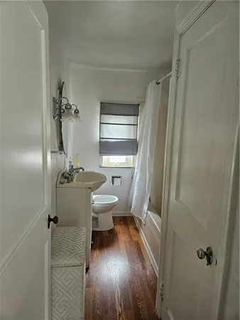 a bedroom with a bed and a chair