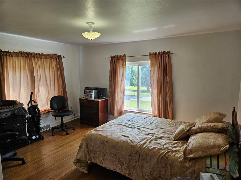 485 Harvey Road Foxburg, PA 16036 - Photo 18 of 25 a bedroom with a bed and a chair