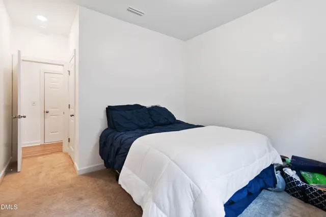 a bedroom with a bed and a closet