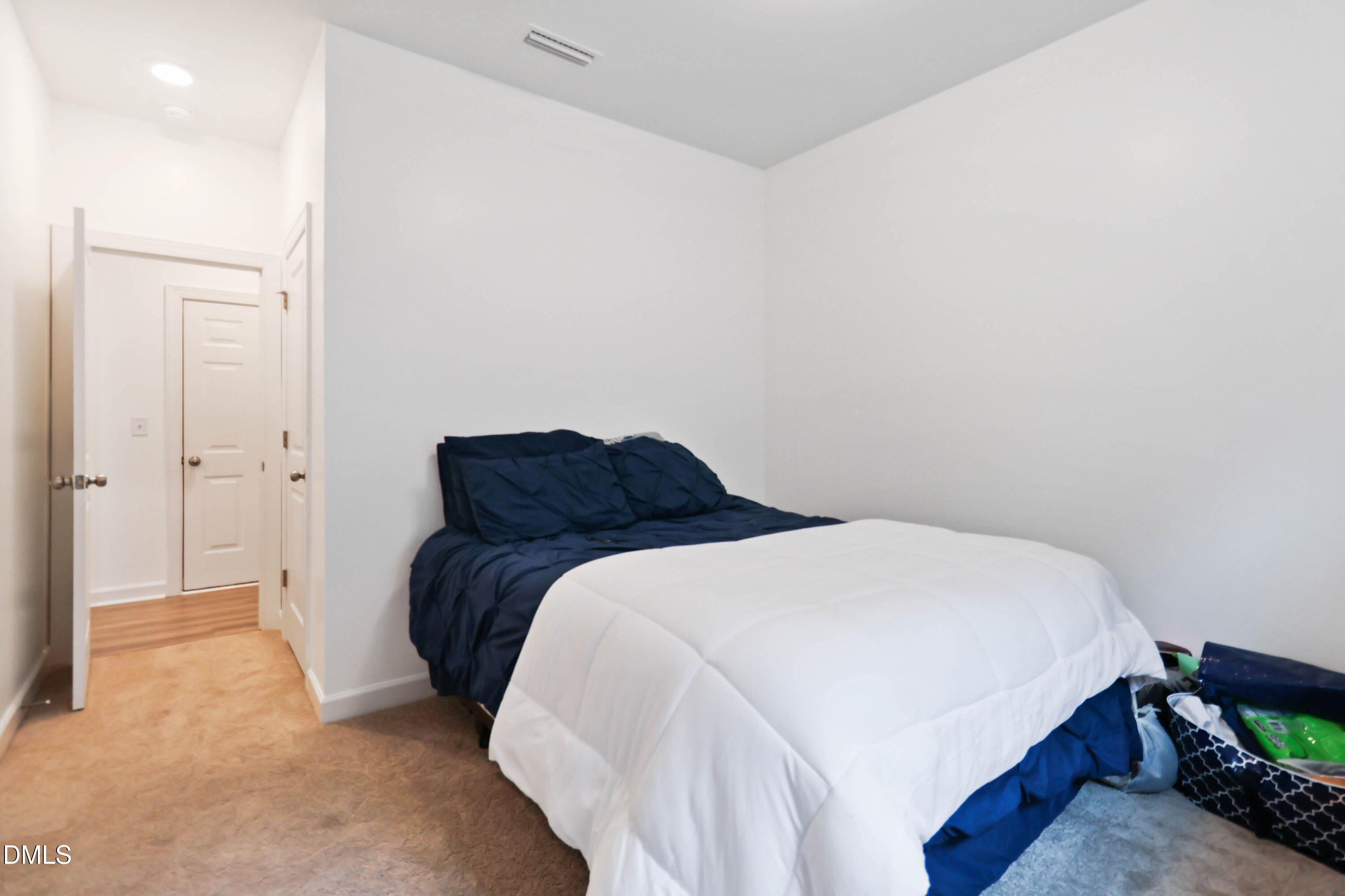 396 Bent Willow Drive Clayton, NC 27527 - Photo 19 of 36 a bedroom with a bed and a closet