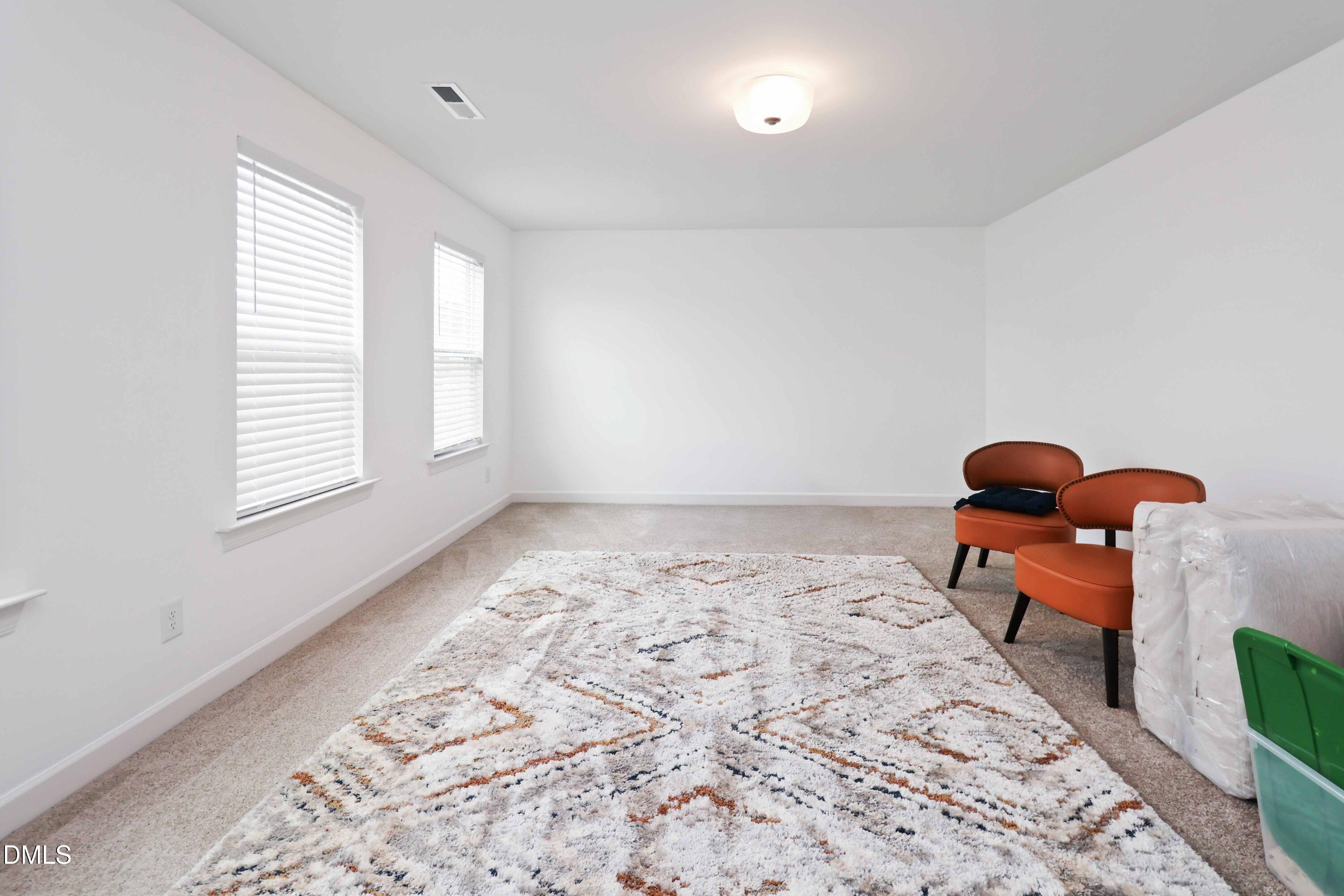 396 Bent Willow Drive Clayton, NC 27527 - Photo 21 of 36 a bedroom with bed and a window