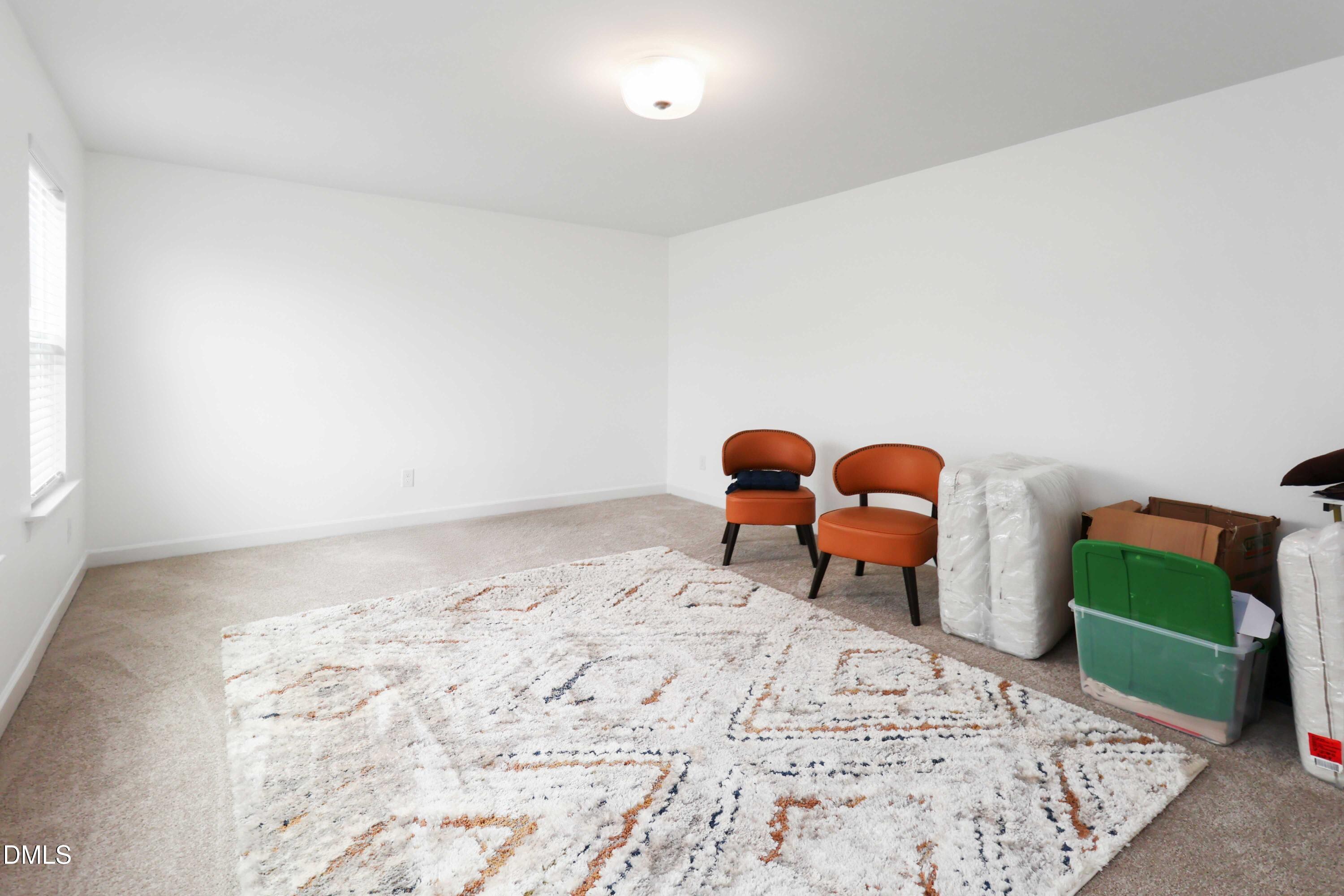 396 Bent Willow Drive Clayton, NC 27527 - Photo 23 of 36 a bed room with two beds and a chair