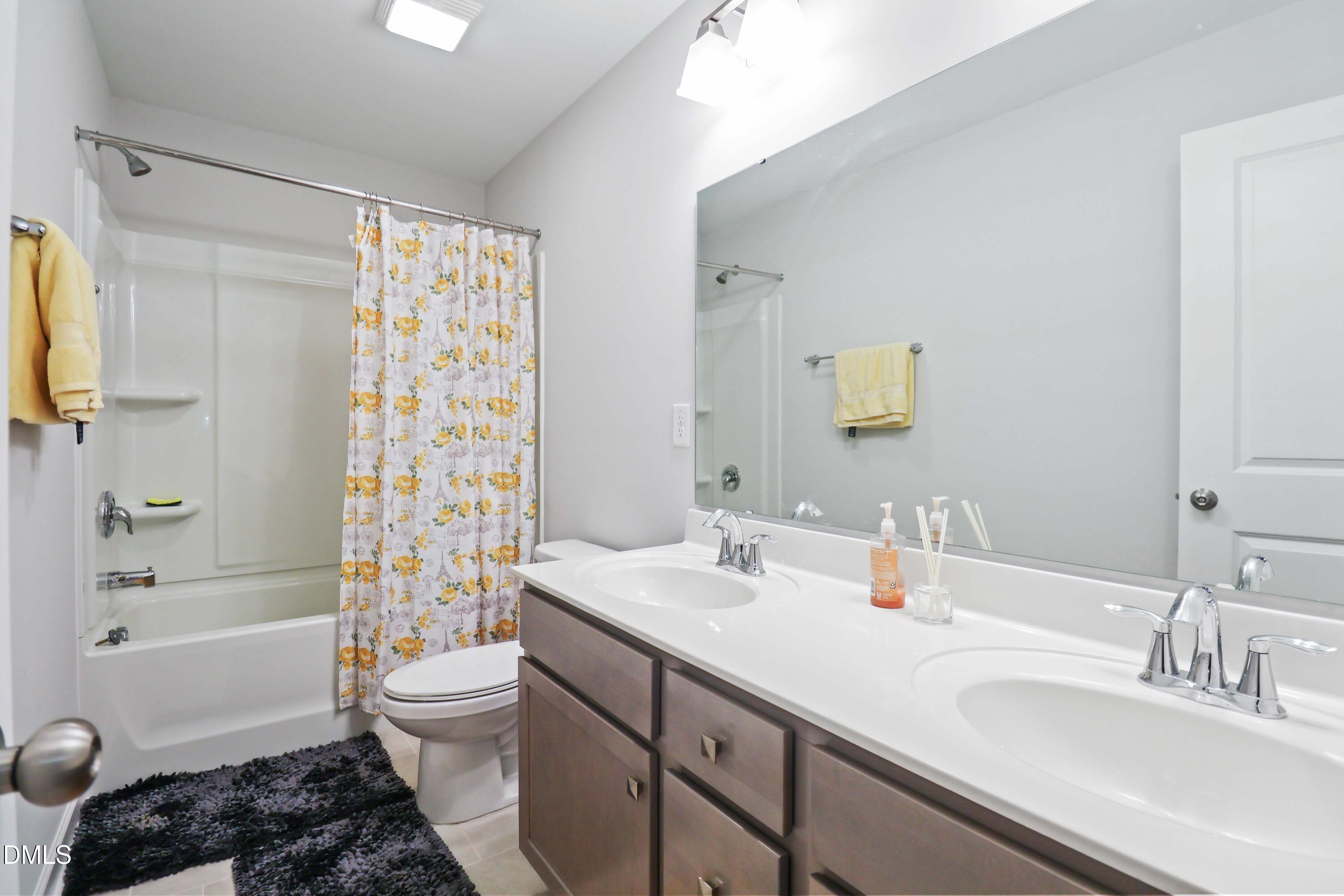 396 Bent Willow Drive Clayton, NC 27527 - Photo 28 of 36 a bathroom with a sink toilet tub and shower