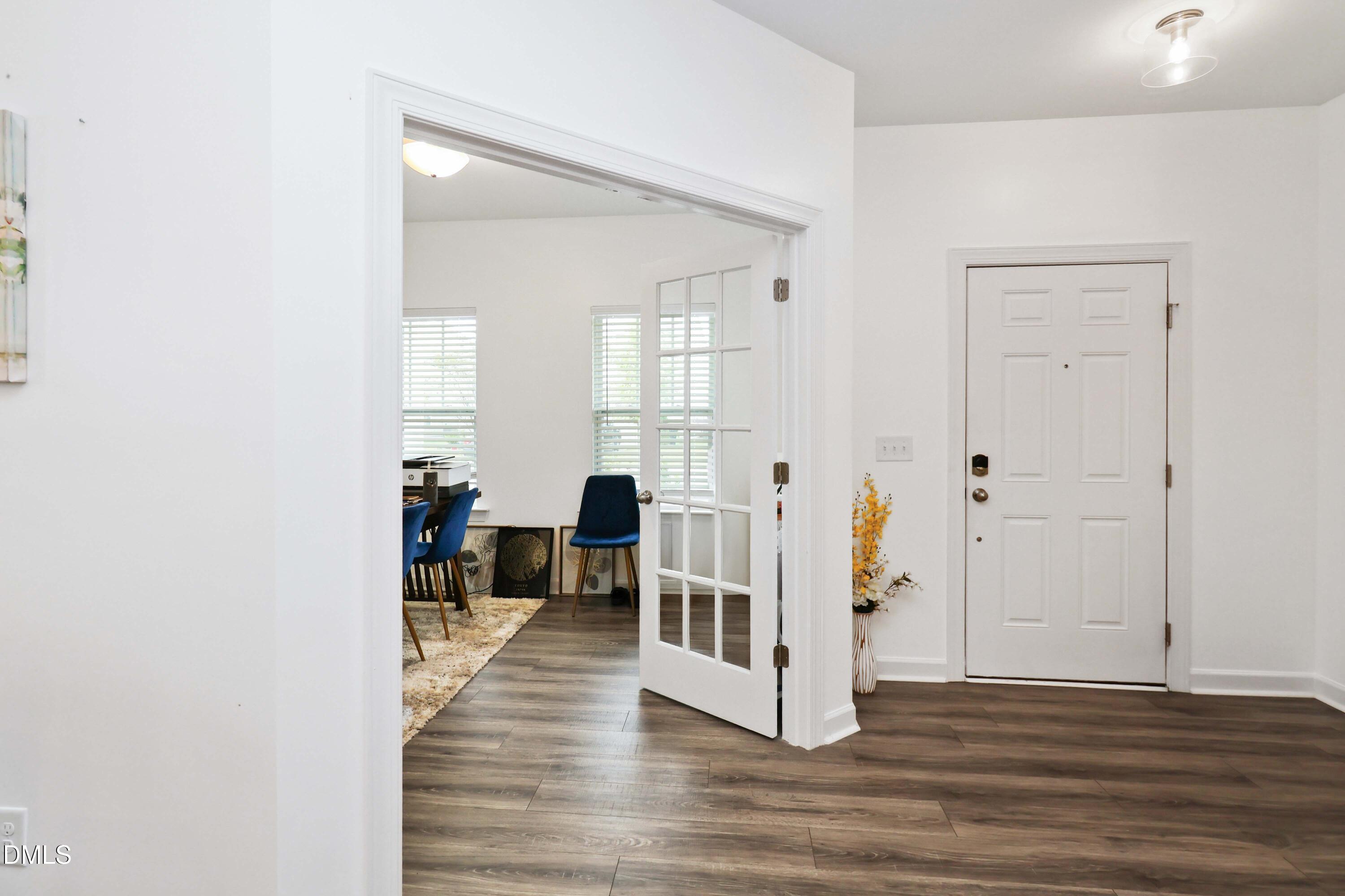 396 Bent Willow Drive Clayton, NC 27527 - Photo 5 of 36 a view of a livingroom with wooden floor and a living room