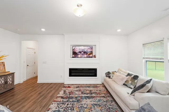 a living room with furniture and a rug