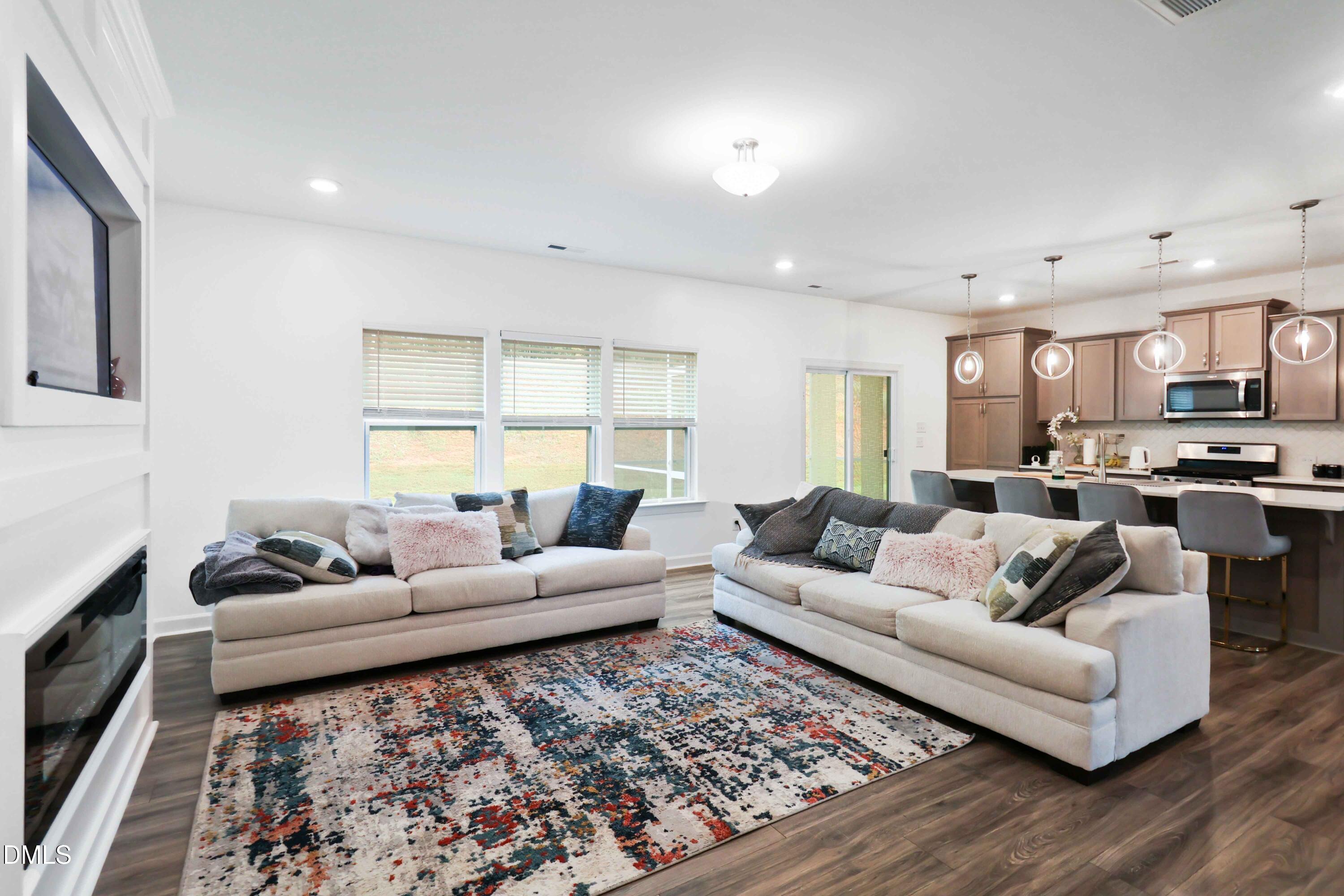 396 Bent Willow Drive Clayton, NC 27527 - Photo 10 of 36 a living room with furniture and a couch