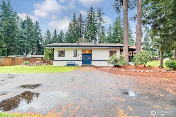 a house with a yard and a trees