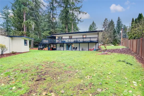 a view of a house with a yard porch and sitting area