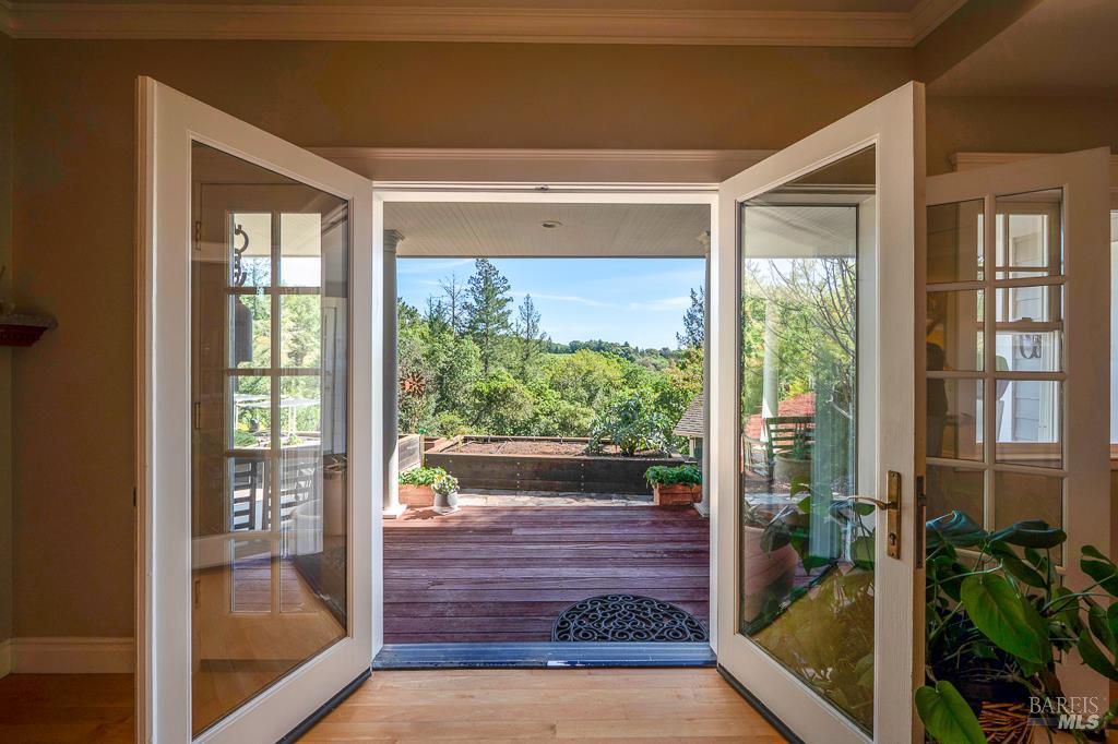 2680 Lawndale Road Kenwood, CA 95452 - Photo 45 of 53 French doors with opening sidelights off the living room open to covered back veranda overlooking raised garden beds and open views.