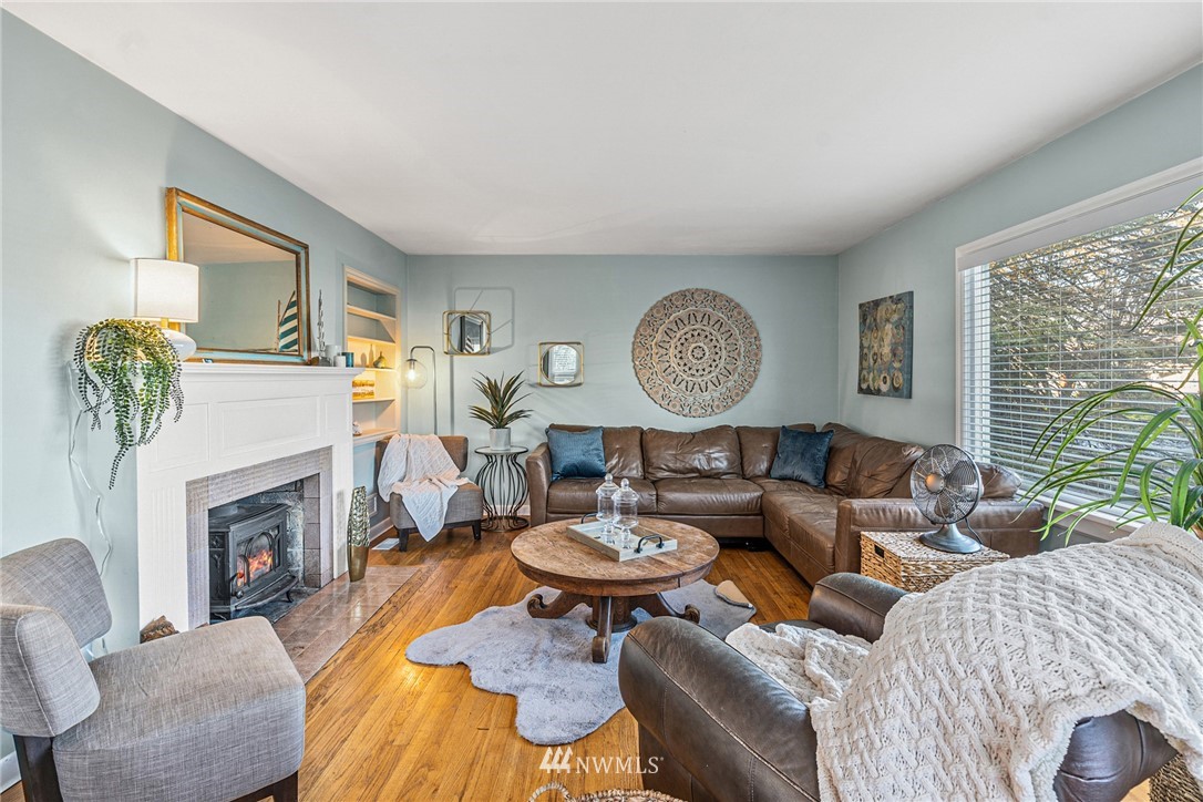 2018 Rucker Avenue Everett, WA 98201 - Photo 5 of 35 a living room with fireplace furniture and a large window
