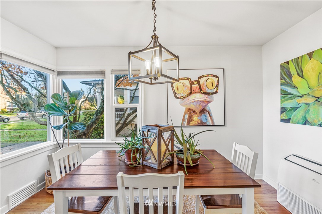2018 Rucker Avenue Everett, WA 98201 - Photo 8 of 35 a view of a dining room with furniture window and wooden floor