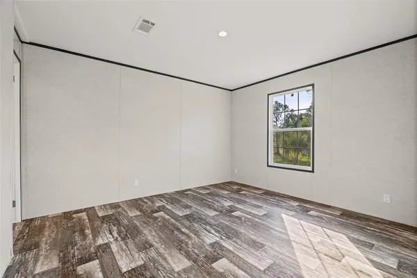 a view of a big room with closet and window