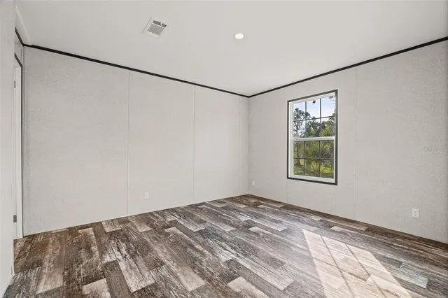 a view of a big room with closet and window