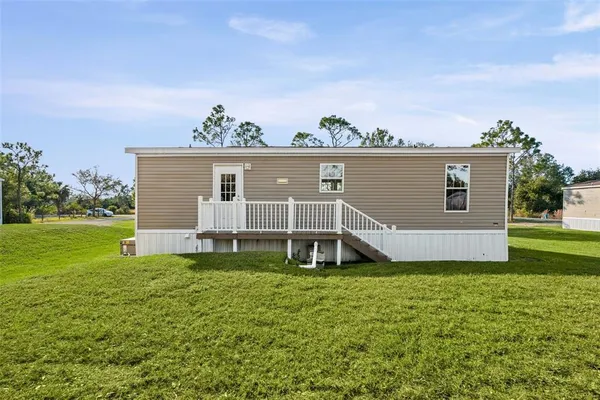 a view of a house with a big yard