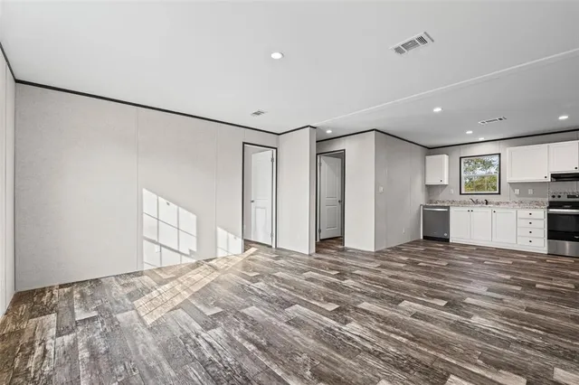 a view of a livingroom with wooden floor