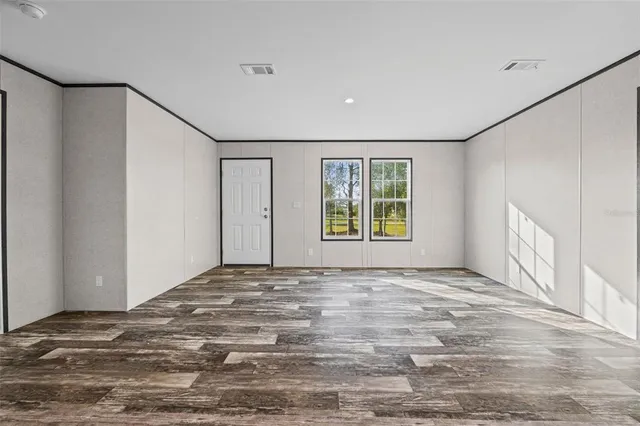 a view of an empty room with a window