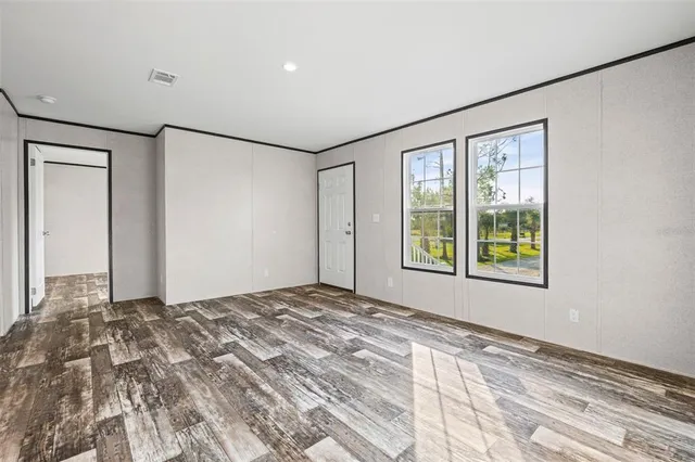 a view of an empty room with a window