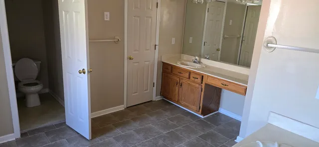 a kitchen with a refrigerator a stove a sink and a counter space