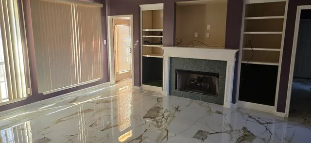 a view of an empty room and window