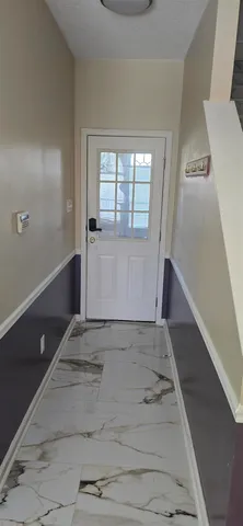 wooden floor and window in an empty room