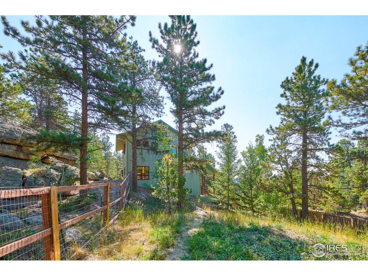 125 Ranch Road Ward, CO 80481 - Photo 4 of 40 a view of swimming pool from a lake view