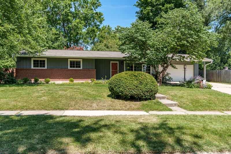 4902 Highcrest Road Rockford, IL 61107 - Photo 1 of 43 a view of a house with yard and a garden