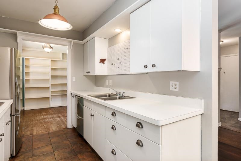4902 Highcrest Road Rockford, IL 61107 - Photo 16 of 43 a kitchen with a sink and cabinets