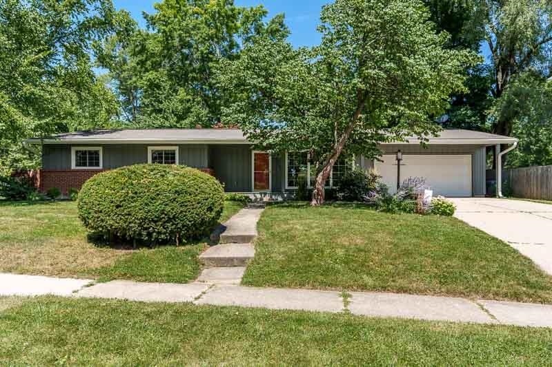 4902 Highcrest Road Rockford, IL 61107 - Photo 2 of 43 a view of a house with yard and a garden