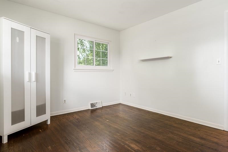 4902 Highcrest Road Rockford, IL 61107 - Photo 24 of 43 an empty room with wooden floor and windows