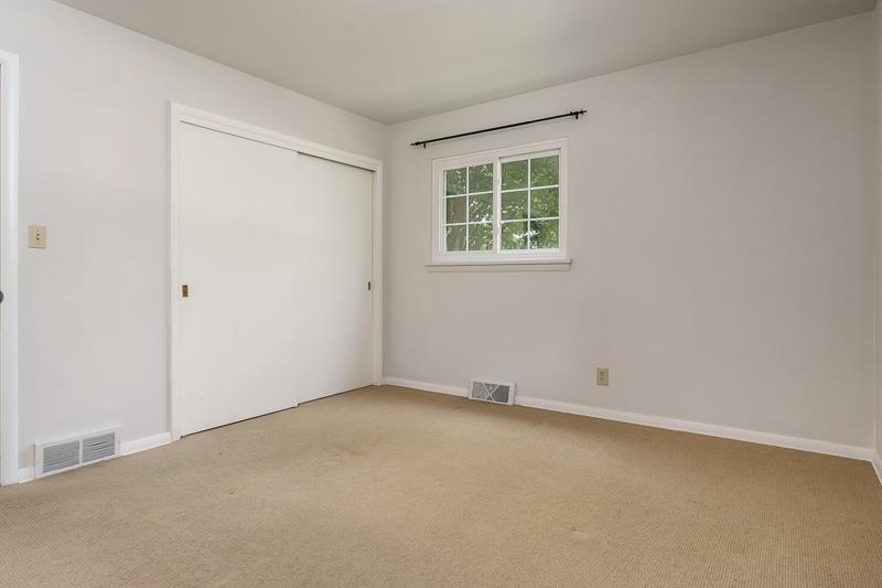 4902 Highcrest Road Rockford, IL 61107 - Photo 27 of 43 an empty room with windows