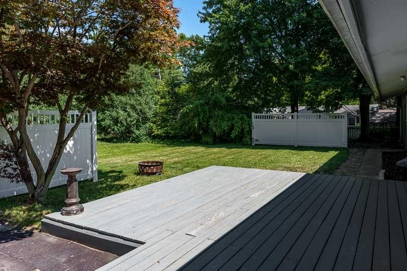 4902 Highcrest Road Rockford, IL 61107 - Photo 39 of 43 a view of a backyard with a wooden deck