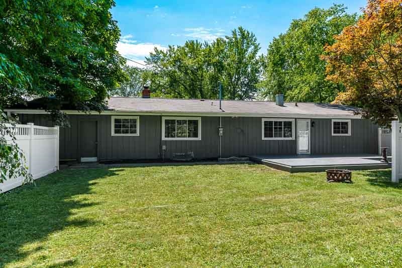 4902 Highcrest Road Rockford, IL 61107 - Photo 43 of 43 a backyard of a house with yard and outdoor seating