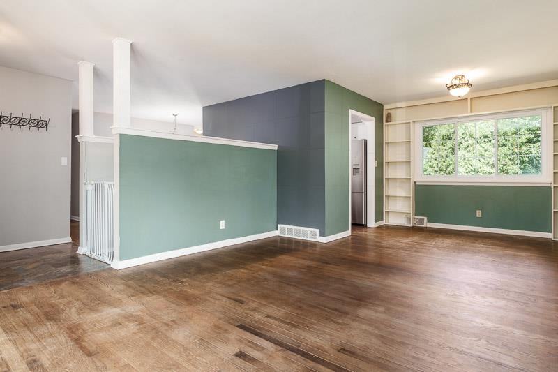 4902 Highcrest Road Rockford, IL 61107 - Photo 7 of 43 an empty room with wooden floor and windows