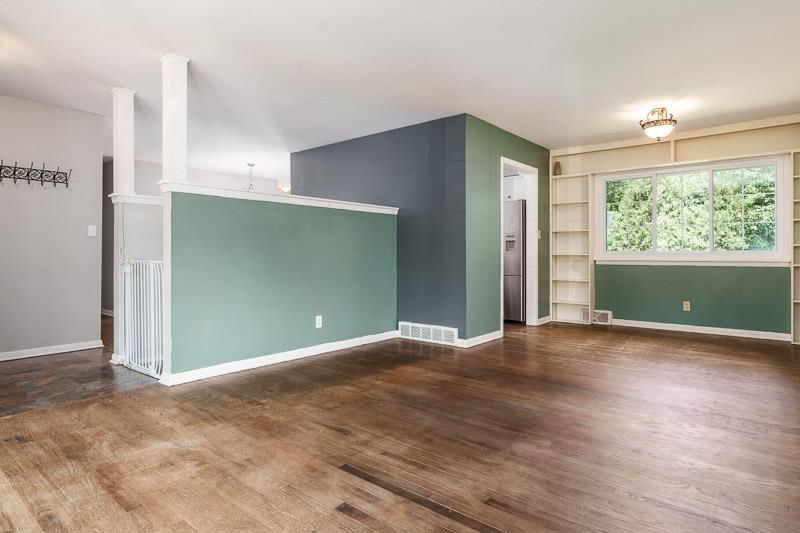 4902 Highcrest Road Rockford, IL 61107 - Photo 8 of 43 an empty room with wooden floor and windows